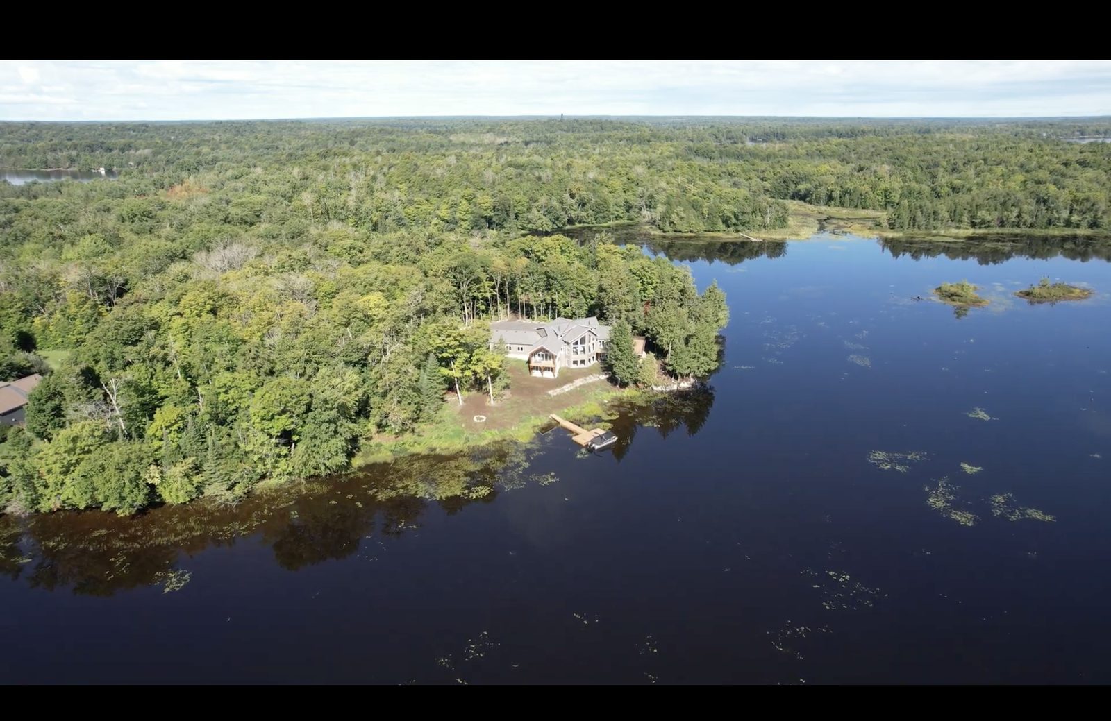Aerial view of a recent A&R lakeside home, the kind of waterfront build a Gravenhurst permit file has to plan around