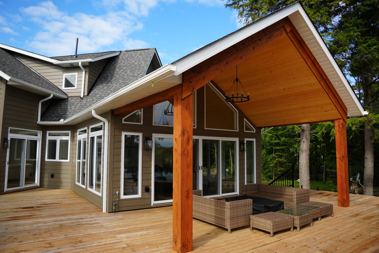 Covered decks facing the water on a recent A&R custom home in cottage country, the kind of lot Gravenhurst's waterfront zoning governs