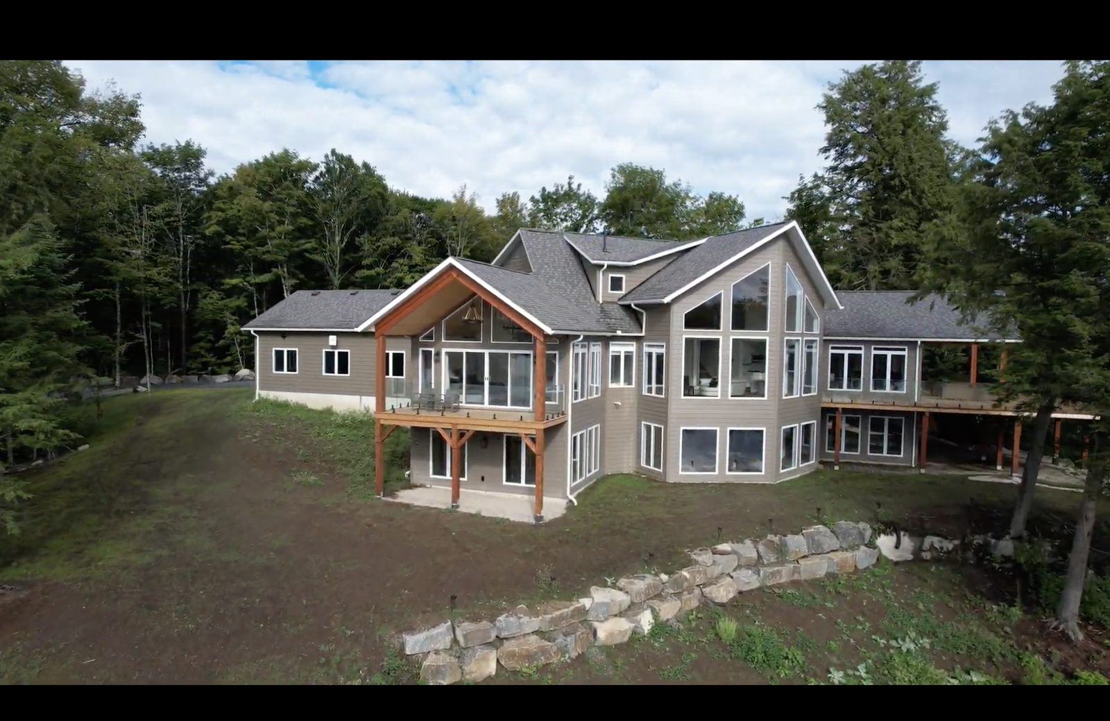 Aerial view of a lakeside custom home by A&R Design Build