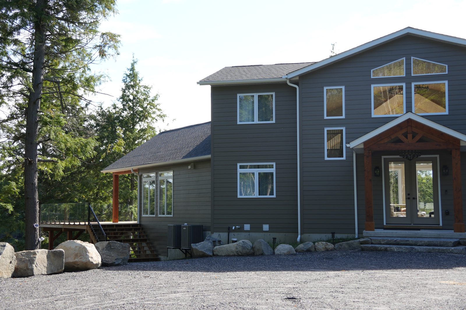 Timber-truss front entry with a three-bay garage